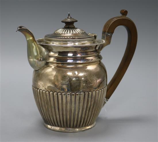 A George III demi fluted silver hot water pot, Robert Hennell II?, London 1810, gross 20 oz.